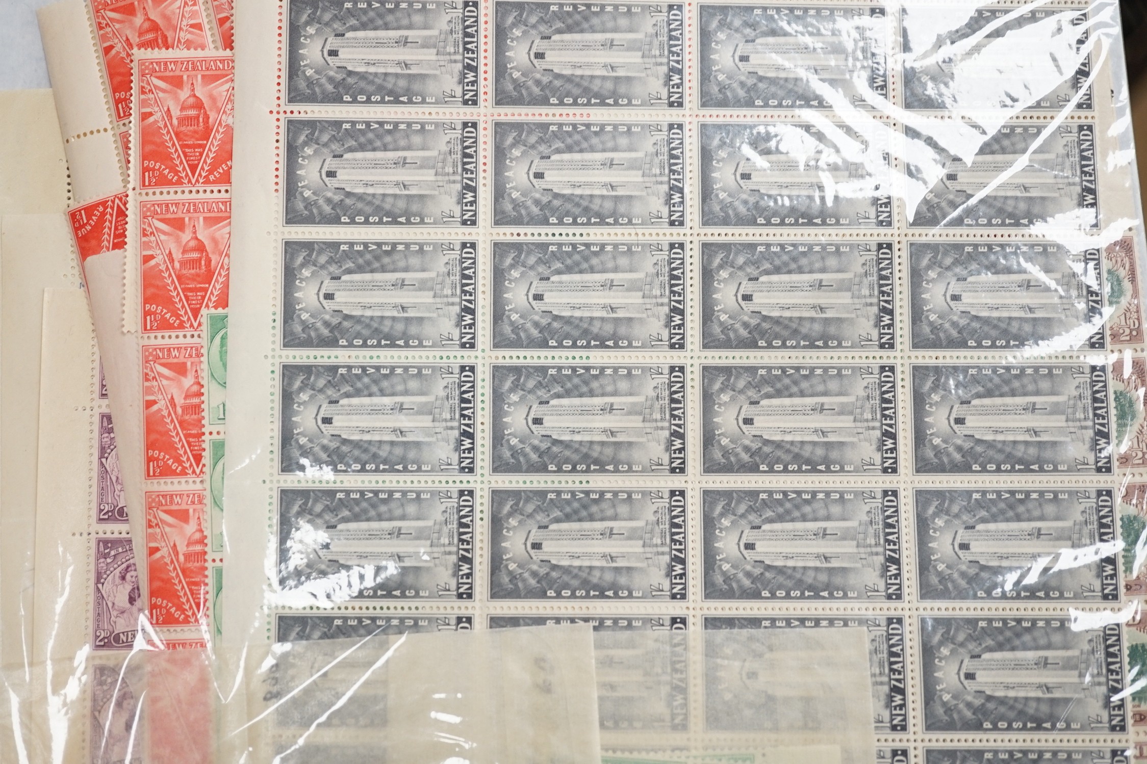 A box of British Commonwealth old auction folders: including Bermuda, Hong Kong1939-52-$10(both), mint set,Mauritius, South Africa and Tangier
